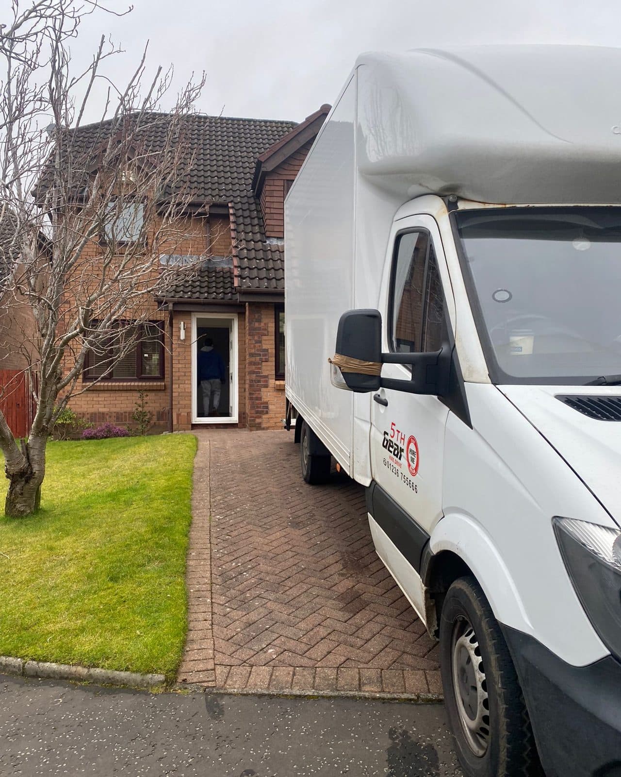 SM Waste Luton van parked at a customer's house in Glasgow